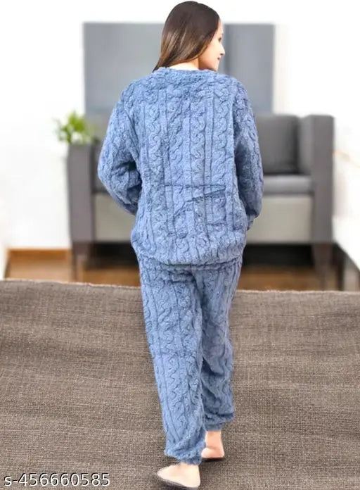 Cozy blue fleece women's pajama set with cute bear design, warm and fuzzy for winter nights