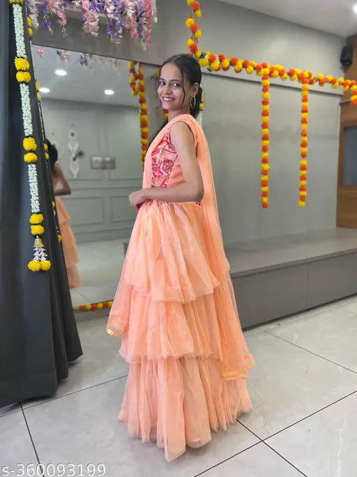 Embroidered ruffule art silk lehenga choli set, semi-stitched with net dupatta, featuring lace borders for women's traditional Indian wear