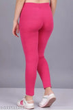 Pink stretchable Lycra jegging for girls - solid design, comfortable and flattering fit for casual or dressy occasions. Made from cotton blend fabric with ankle length and pockets. Indian origin