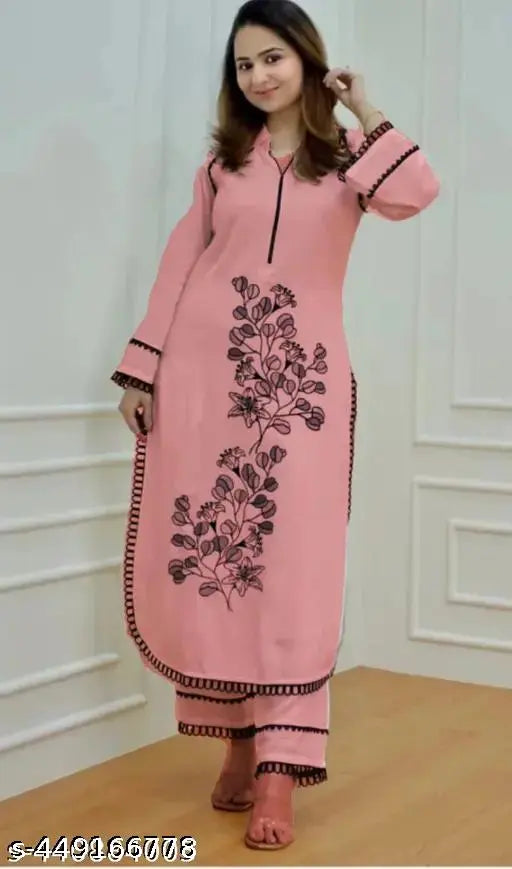 Rayon embroidery coord set: Kurta pant set with three-quarter sleeves, embellished in black butta, Pakistani origin