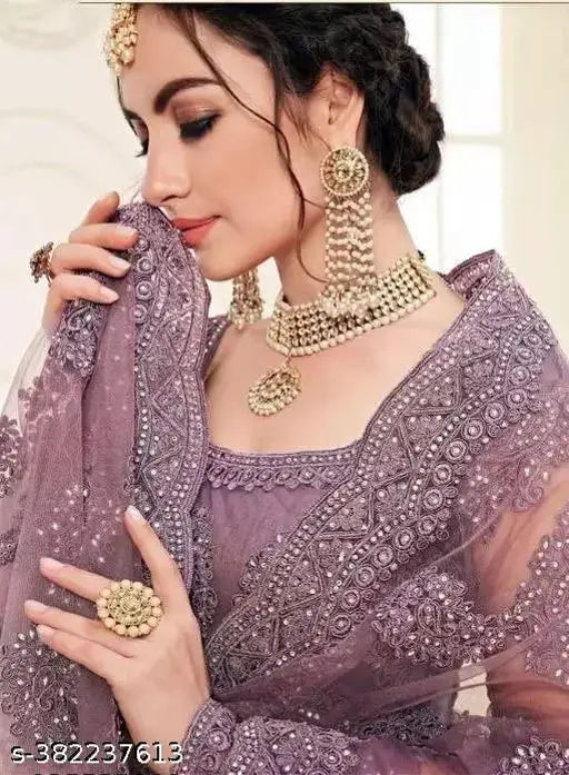 Purple embroidered net lehenga set, free size with 42" waist and 42" length, Indian designer bridal wear on display