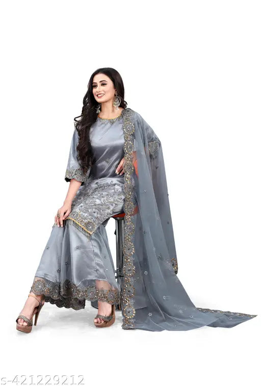 Embroidered summer fancy zari cut work salwar lehenga dupatta set in net fabric. Indian ethnic motifs with tassel detailing and sequins accents for festive celebrations