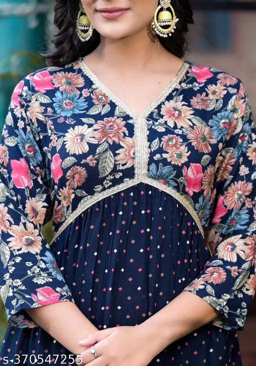 Blue rayon A line Alia kurti with pocket, features three-quarter sleeves and printed combo design. S (bust 34in, length 45in) available. Indian craftsmanship