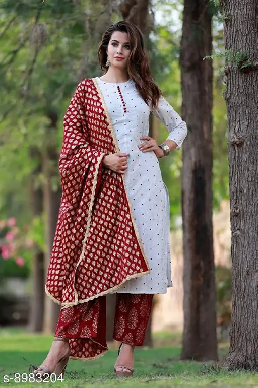 Stylish cotton kurta pant set in vibrant print, three-quarter sleeves. Cotton & rayon bottomwear. Indian-made fashion