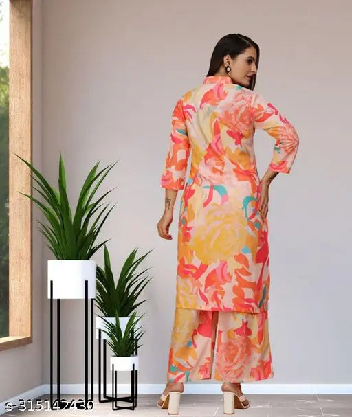 Cream peach rayon co-ord set090: Printed kurta with bottomwear, three-quarter sleeves, and mandarin collar. Multi-colored design, pocket in plazzo, suitable for every occasion. Pack of 2 sizes S-XXL. Indian origin