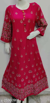 Trendy rayon kurti with camellia print, three-quarter sleeves, ideal for day wear or special occasions. Made in India." (124 characters)