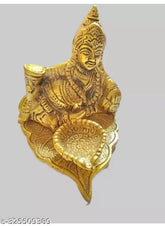 Metal leaf Kuber Diya with paan design, aluminum home decor gift. Dimensions: 25 x 10 x 10 cm. Origin: India