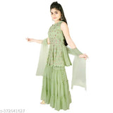 Green Georgette embroidered salwar suit for girls, short sleeves and self-design net detail. Indian girls' fashion wear on model