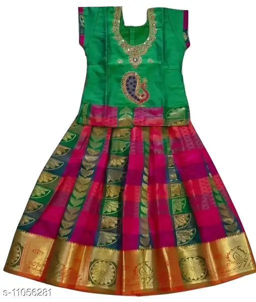 Traditional green art silk pattu pavadai lehenga for baby girls, solid pattern Indian attire on display