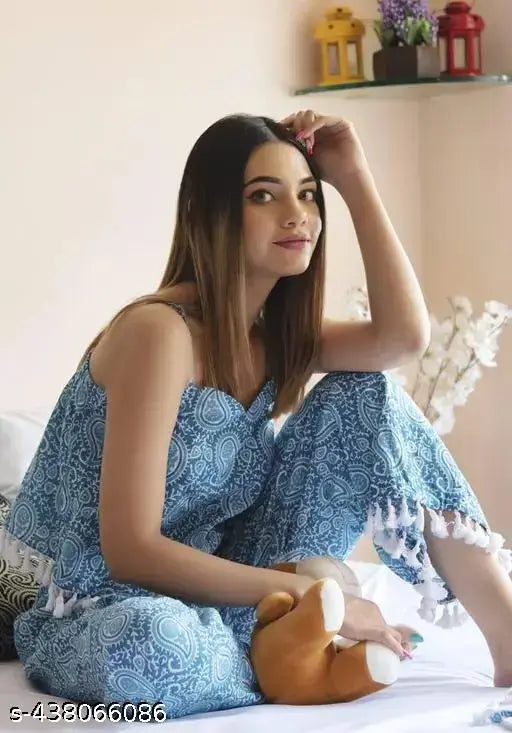 Printed rayon nightsuit set with sleeveless striped top and coordinating floral-printed bottom, featuring a sweetheart neckline and elastic waistband for comfort. Made in India