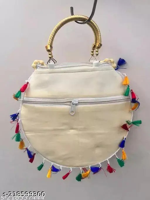 White cotton canvas sling shoulder bag with embroidery for girls & women, Indian-crafted with mirror work and pom pom trim. Handmade in Rajasthan, unique design, zipper closure