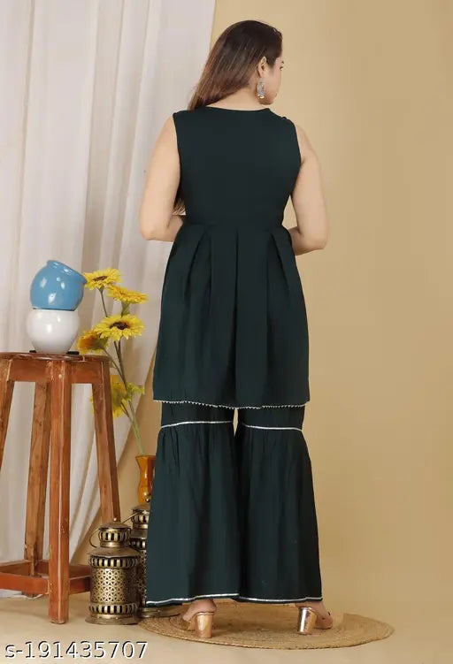 Green Rayon Kurta Set with Sharara and Dupatta: Elegant Indian wear for festive and daily occasions. Single set includes one kurti, sharara, and dupatta, made from lightweight rayon fabric in a unique design. Perfect for gifting