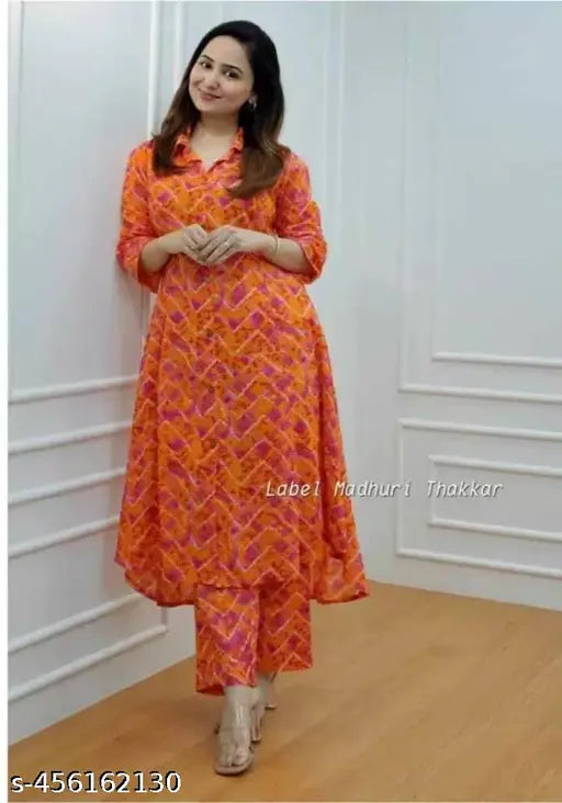 Orange leheriya rayon kurta and palazoo set, three-quarter sleeves, printed net pattern. Perfect for summer party wear or casual events. India origin