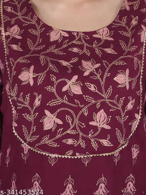Rayon wine-colored women's and girls printed gold kurti with sharara sets, three-quarter sleeves, accessorized with lace work on yoke and sharara, India origin