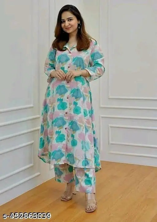 Rayon printed kurta set with pants, featuring three-quarter sleeves and vibrant Indian print. Set includes sizes M, L, XL, XXL, XXXL. High-quality rayon fabric from India