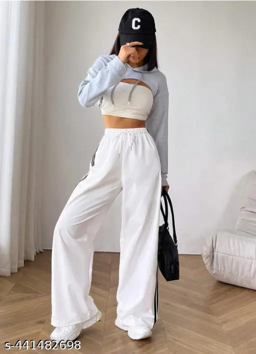 White cotton blend Tamina Women's jogger with solid net pattern, featuring two side stripes and two pockets, and an elastic waistband. Soft and comfortable for lounging or sleepwear. Made in India