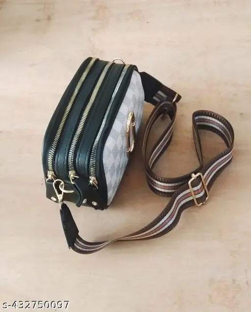 PU leather adjustable sling bag, fashionable unisex design, ideal for essentials. Trippal chain detail on brown solid bag