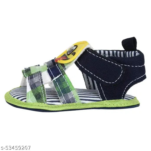 Canvas and PVC cartoon character sandals for infants, velcro fastening, anti-skid rubber sole. Ideal for ages 0-12 months, sizes 3-6 months, 6-9 months, 9-12 months. India origin