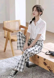 White and black check cotton pajama combo on hangar, set includes two sizes 26 and 28-32 for comfortable sleepwear