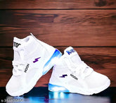 White canvas sneakers with LED lighting for kids (0-7 years), featuring breathable cotton blend material and adjustable hook & loop closure. Ideal for night outings and exploration