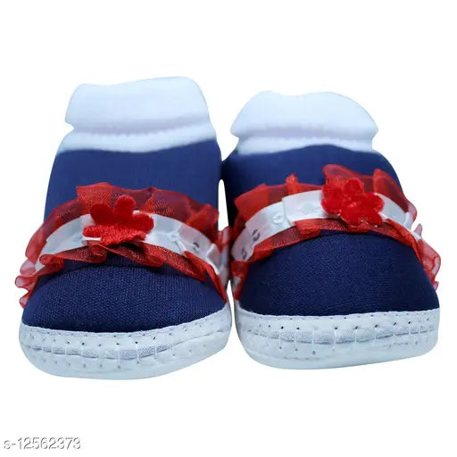 Navy blue cotton and PVC flower booties/ socks for baby boy & girl 0 to 12 months - embellished design, slip-on (Optional: Baby footwear on soft cushioned surface)