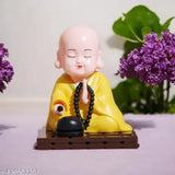 Solar-powered Buddha Monk Statue, moving head & hand - enhances health, wealth & prosperity. Plastic figure for car dashboard, home, or office desk decor. Ideal for travel memorials, housewarmings, or gift giving