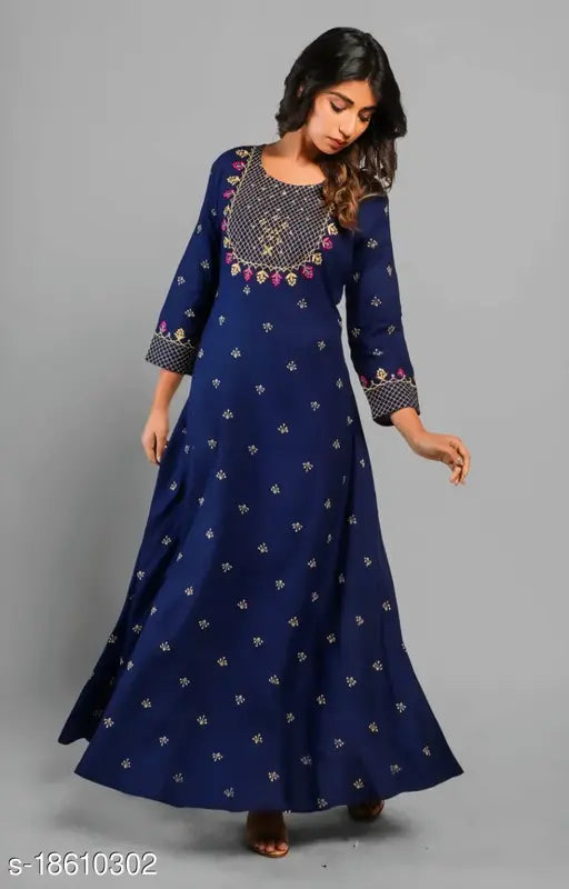 Blue IBBA Women's embroidered rayon A-line kurta with three-quarter sleeves, showcasing intricate Indian craftsmanship on a blue background
