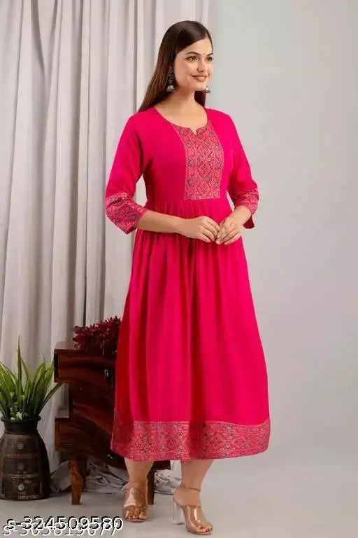 Rayon women's three-quarter sleeve anarkali kurti/kurta, solid design, S-XXL sizes. Anarkali kurti in traditional Indian style on a model wearing accessories