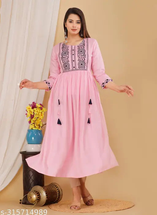 Embroidered rayon kurti, calf length, three-quarter sleeves. Indian women's fashion for casual or semi-formal events