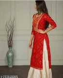 Red traditional Indian kameez and lehenga set with long skirt and embellished sleeves