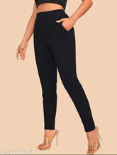 Solid black polyester pencil trousers for women, elasticated with pockets - Dream Beauty Fashion, India