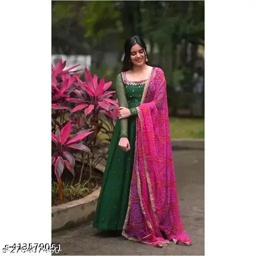 Green Georgette bandhani maxi dress with mirror work and stone embellishments, perfect for casual wear. Digital print dupatta included with four side lace detailing. Made in India, size S-36 to XXL-44