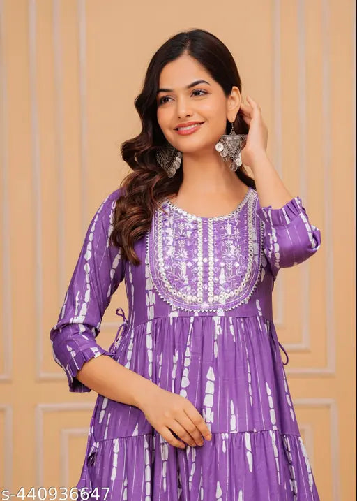 Women's printed viscose rayon A-line single top with three-quarter sleeves, dyed/washed combo. Viscose rayon women's fashion top on model, various sizes available