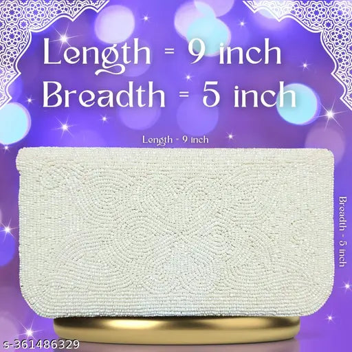 White beaded fabric clutch, embroidered net design, spacious compartment. Handcrafted Indian fashion accessory for women's events