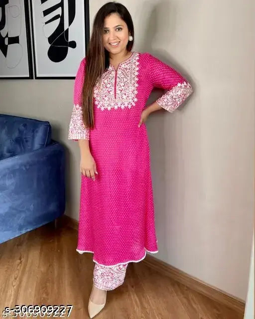 Women's A-line Rayon Kurta with Plazoz embroidery, round neck, three-quarter sleeves. Party and wedding wear, attractive and trendy Indian outfit on display