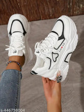 Textured canvas sneakers with PVC sole, lace-up fastening, and net back detail. Available in sizes 3 to 8, 21-24.5 inch foot length. Indian origin