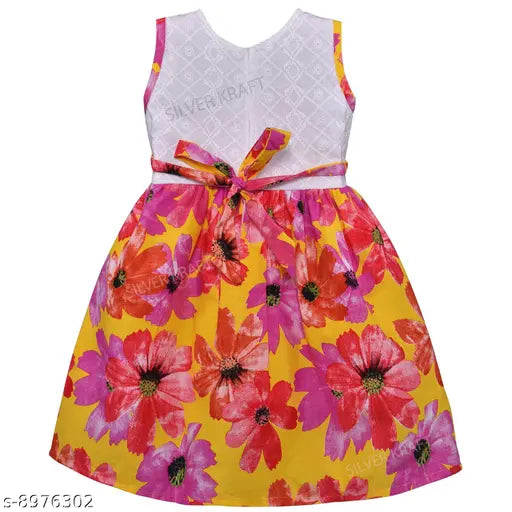 Silver kraft baby girl's cotton dress with printed net pattern, sleeveless and available in various sizes: 3-6M, 6-12M, 12-18M, 18-24M, 1-2Y, 2-3Y, 3-4Y, 4-5Y, 5-6Y. Made in India