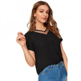 Black polyester knitted western wear t-shirt for women, solid design on apparel rack