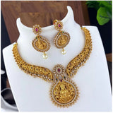 Gold plated women's necklace and earrings set with kundan work, multi-colored and free size jewelry on display stand