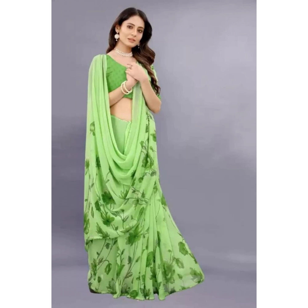 Green georgette printed saree with unstitched blouse for women, vibrant Indian fashion accessory on mannequin