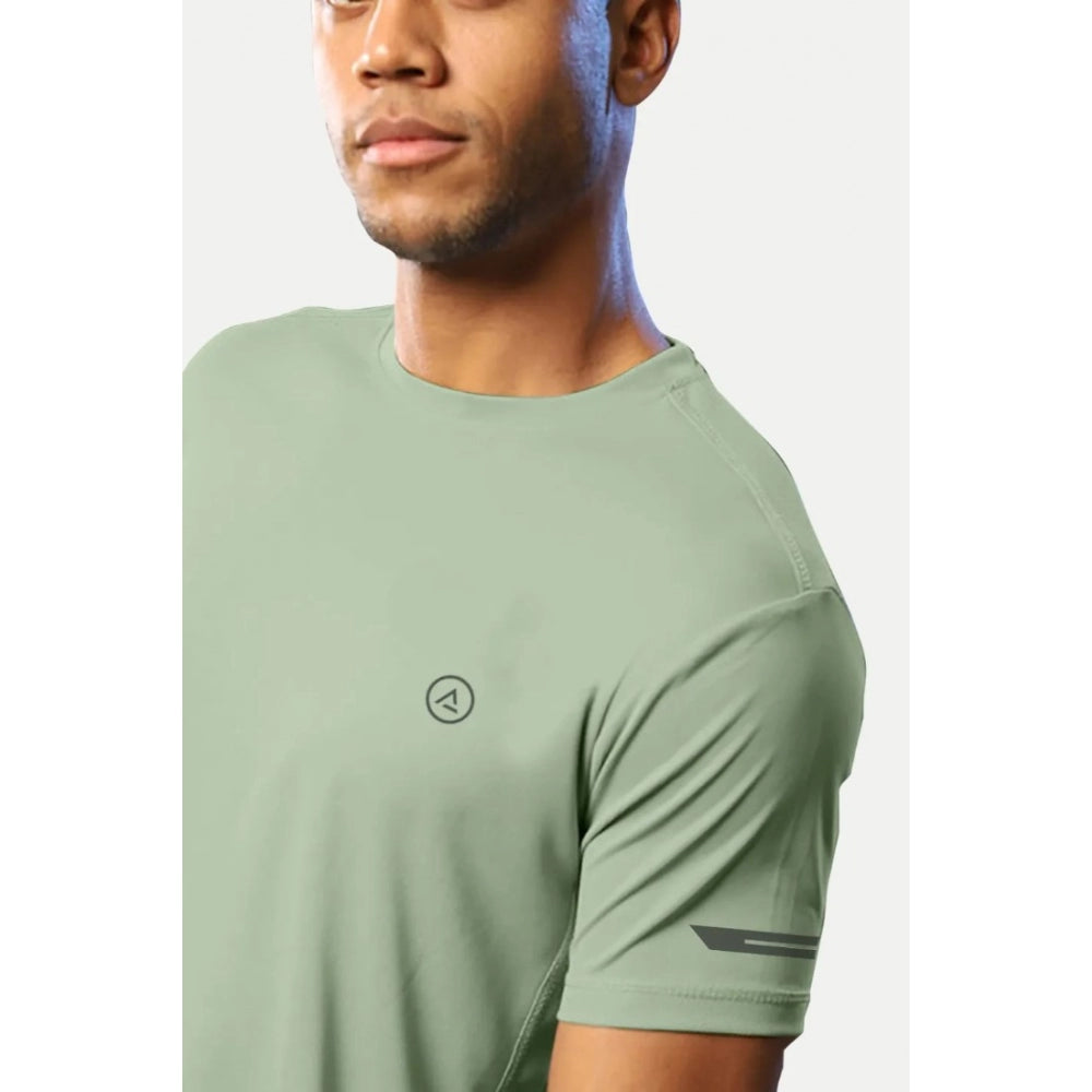 Men's casual pista green polyester half sleeve crew neck t-shirt with regular fit, solid design on mannequin