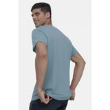 Teal digital printed cotton half-sleeve crew neck t-shirt for men, regular fit, casual style on display rack