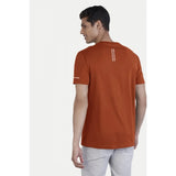 Men's rust polyester half sleeve crew neck solid t-shirt on model, casual fit for everyday wear