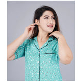 Green viscose rayon printed half-sleeve shirt with pyjama pant night suit set, notch collar style on mannequin