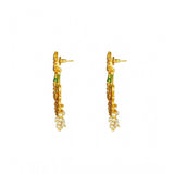 Rose gold plated alloy Kundan earrings & Mangtikka in red and green for women, intricate design on display stand