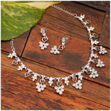 Rose gold plated brass necklace & earrings set in silver tone, elegant jewelry on display