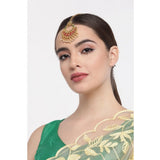 Rose gold plated alloy Kundan earrings & Mangtikka - Red & Green, intricate Indian jewelry on display