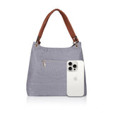 Blue faux leather textured tote bag with zipper closure and dual handles