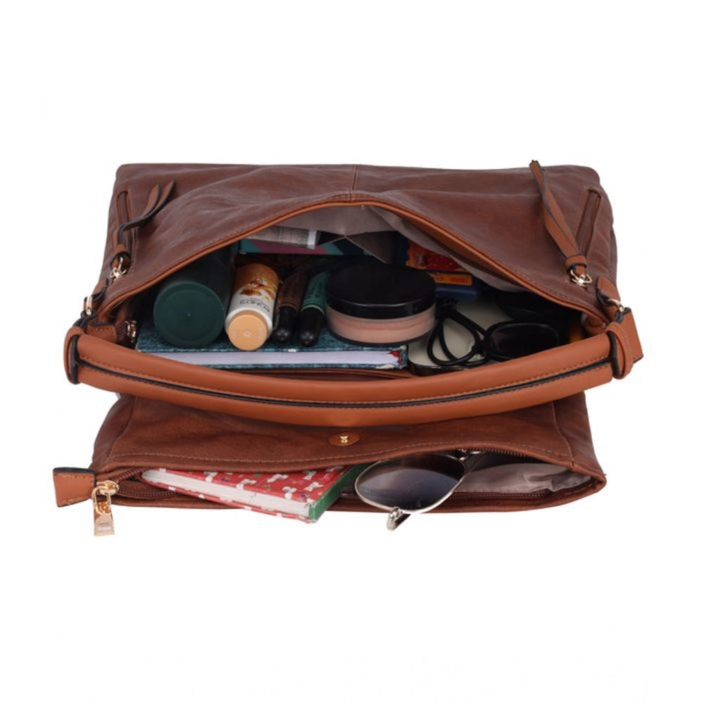 Brown faux leather sling bag with dual handle and zipper closure