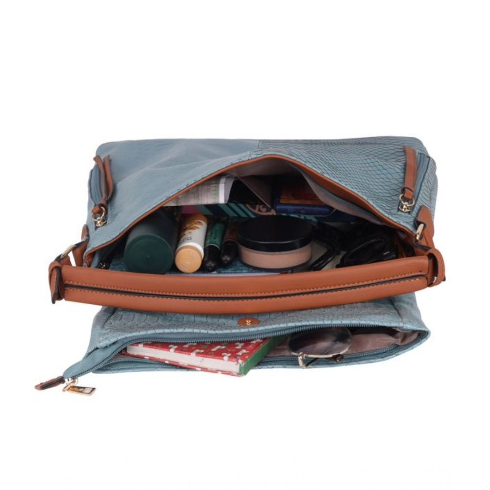 Blue faux leather textured sling bag with dual handle, synthetic lining and zipper closure